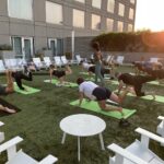 Sunrise yoga in a hotel courtyard