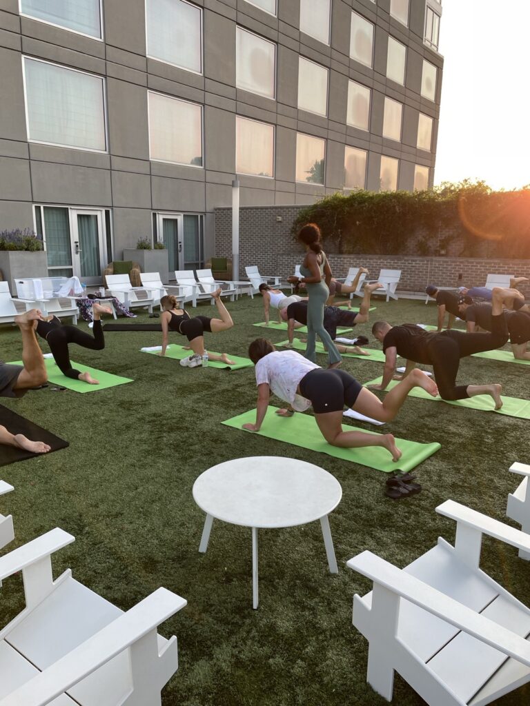 Sunrise yoga in a hotel courtyard