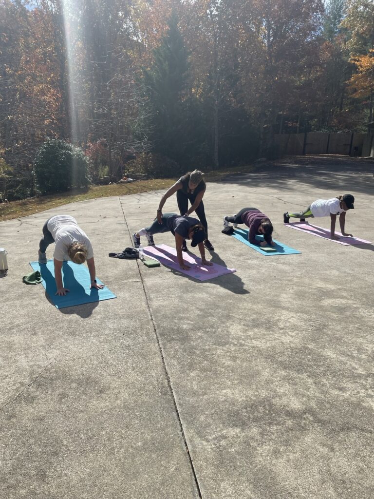 Outdoor yoga practice among autumn trees