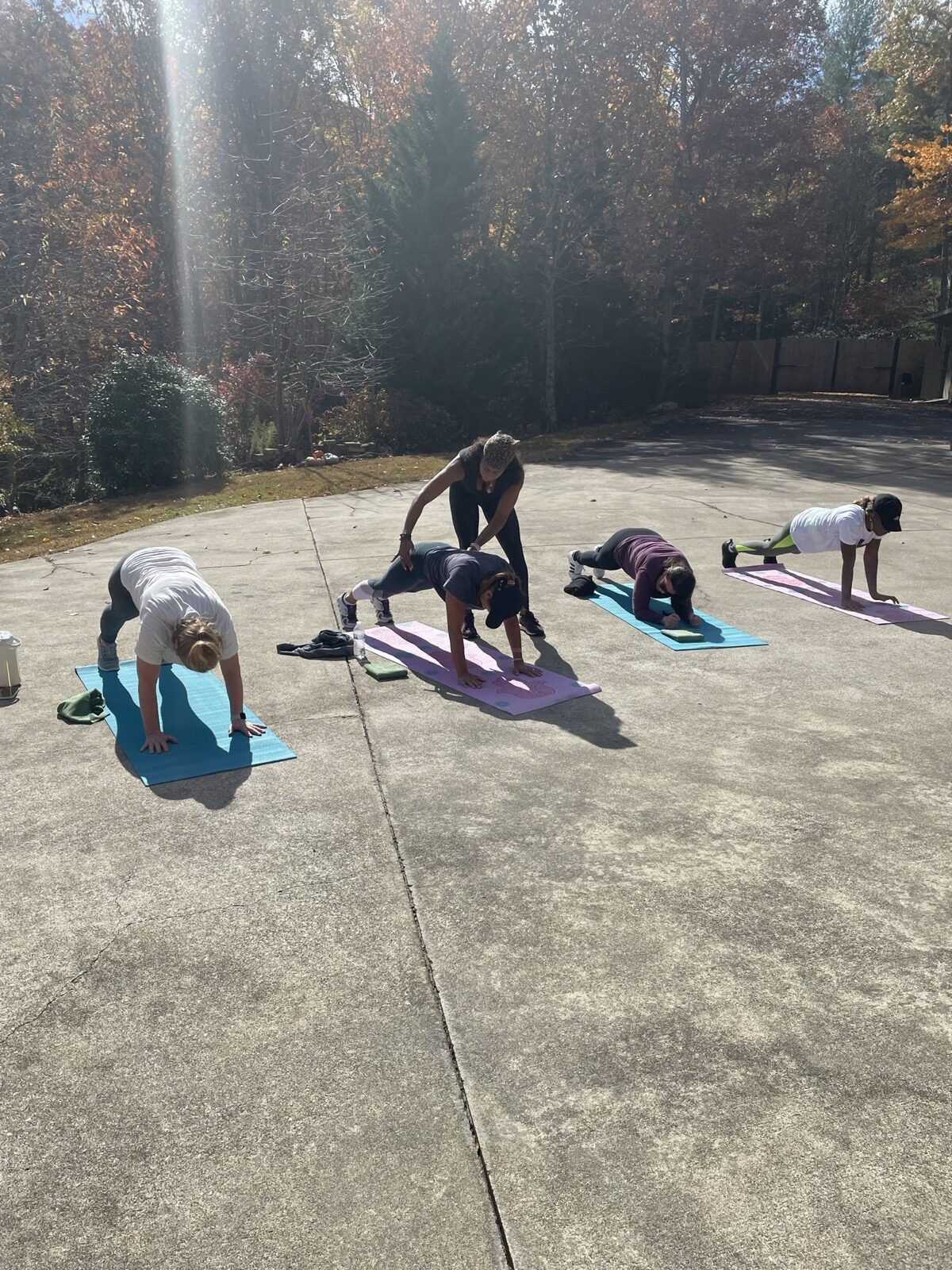 Outdoor yoga practice among autumn trees