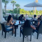 Poolside gathering under the palms